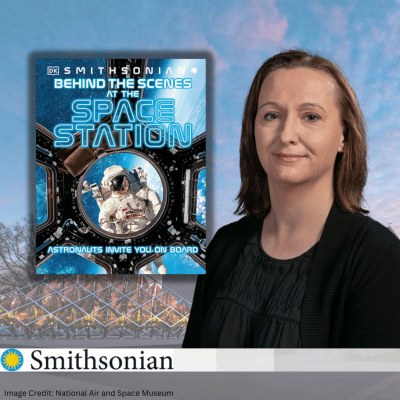 Dr. Jennifer Levasseur with the book Behind the Scenes of the Space Station